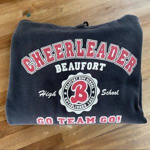 Cheerleading sweatshirt.